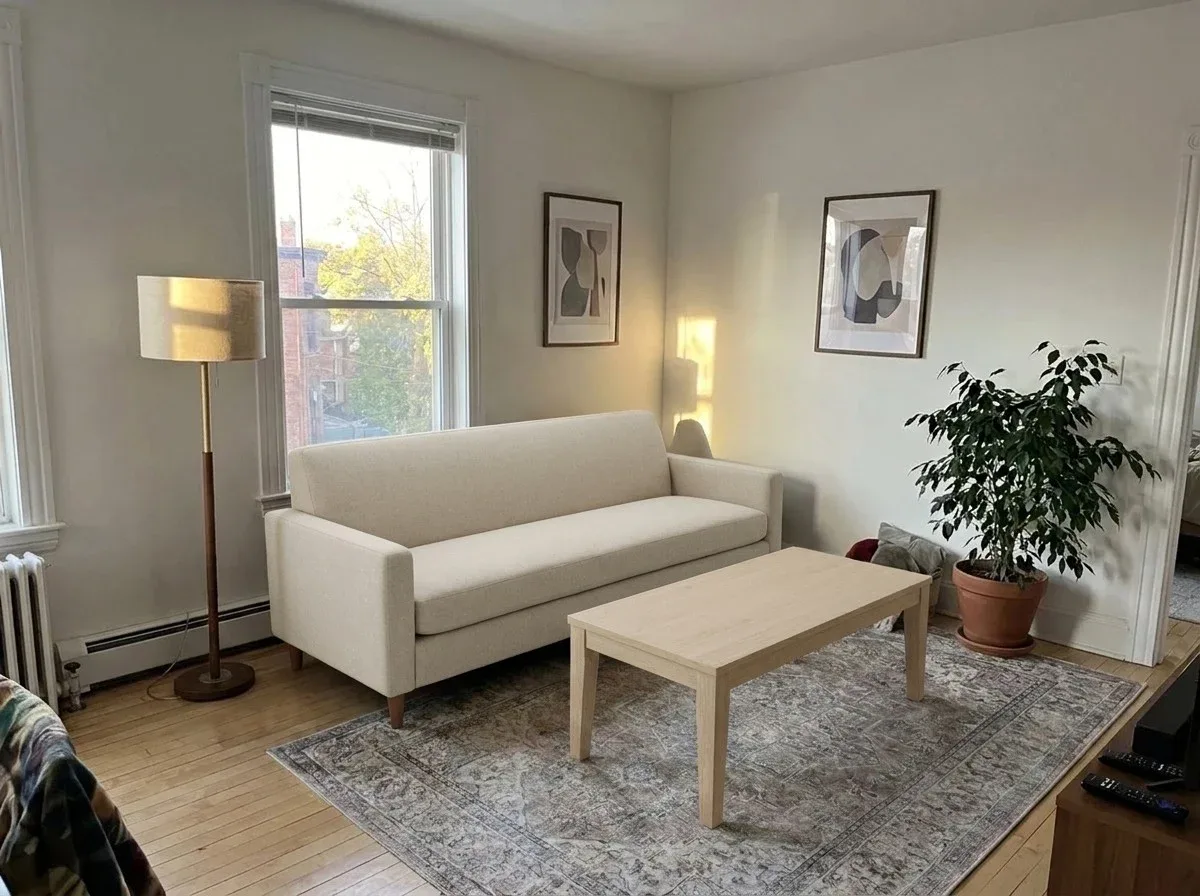The same room with a new sofa and coffee table in oatmeal linen